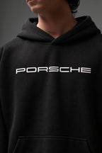 Close-up of the white PORSCHE chest print