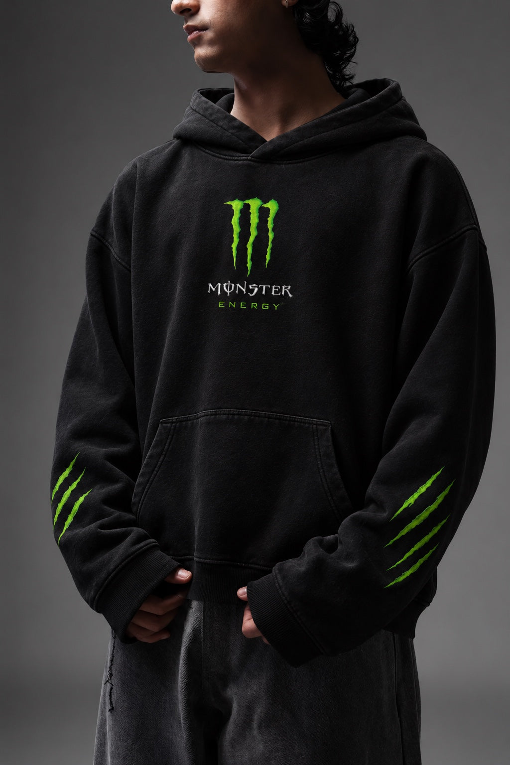 AMARCO MONSTER black oversized hoodie front view with hands near pocket