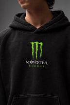 AMARCO MONSTER black hoodie green chest print close-up