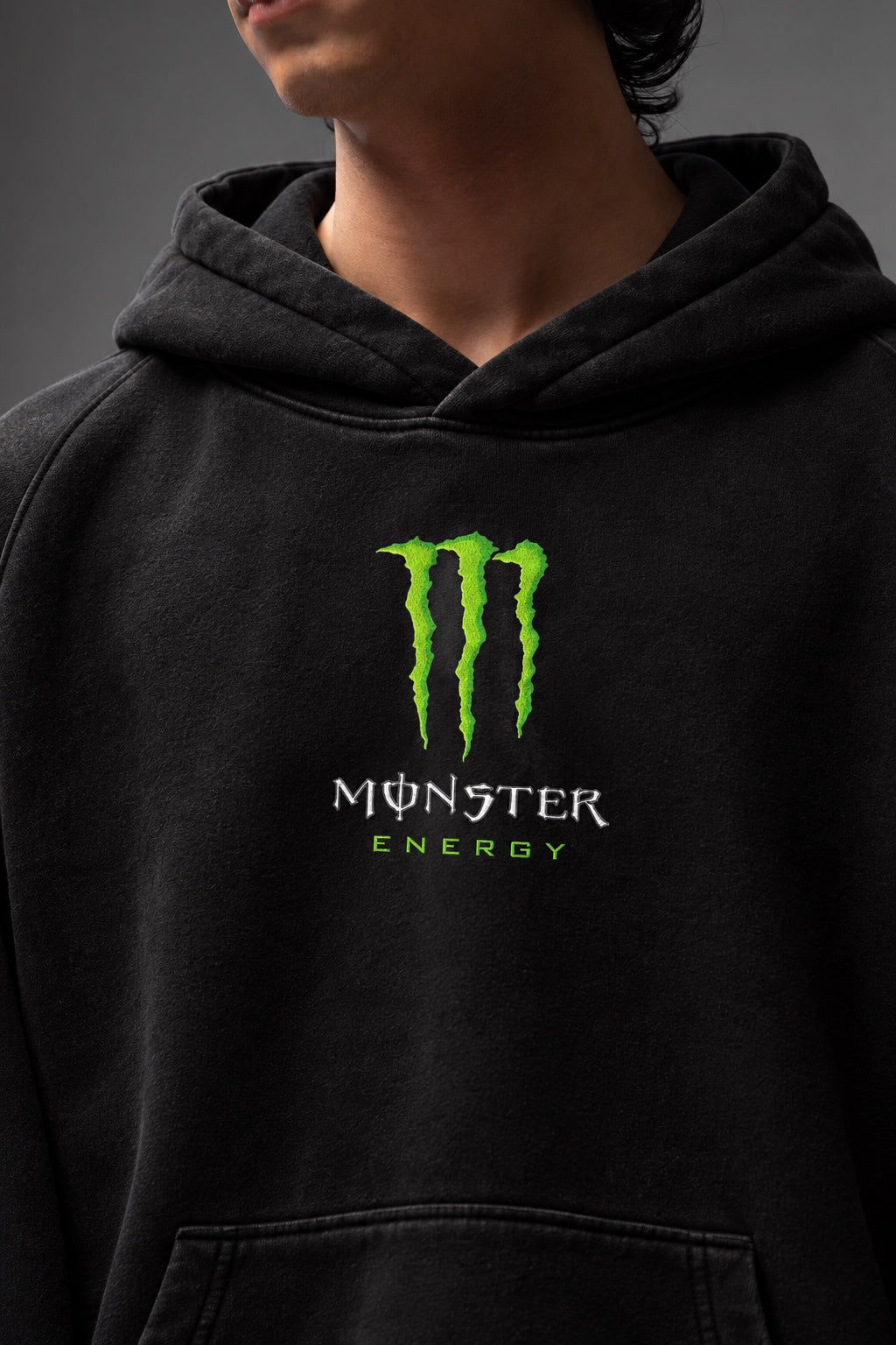 AMARCO MONSTER black hoodie green chest print close-up