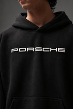 Close-up of the raised white PORSCHE chest lettering