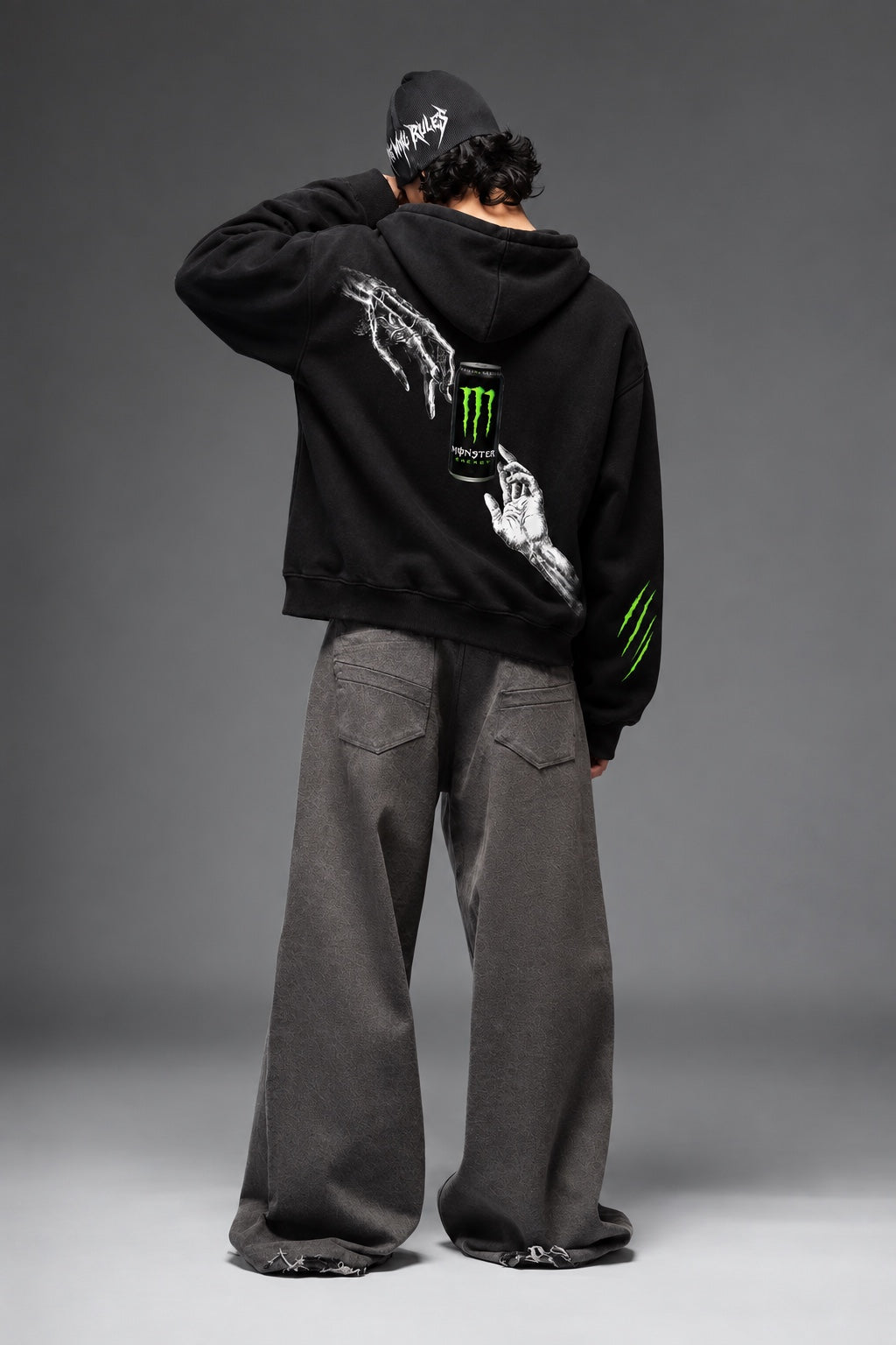 AMARCO MONSTER black oversized hoodie back view with raised arm
