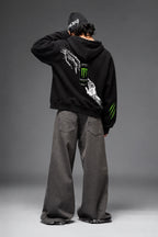 AMARCO MONSTER black oversized hoodie back view with raised arm