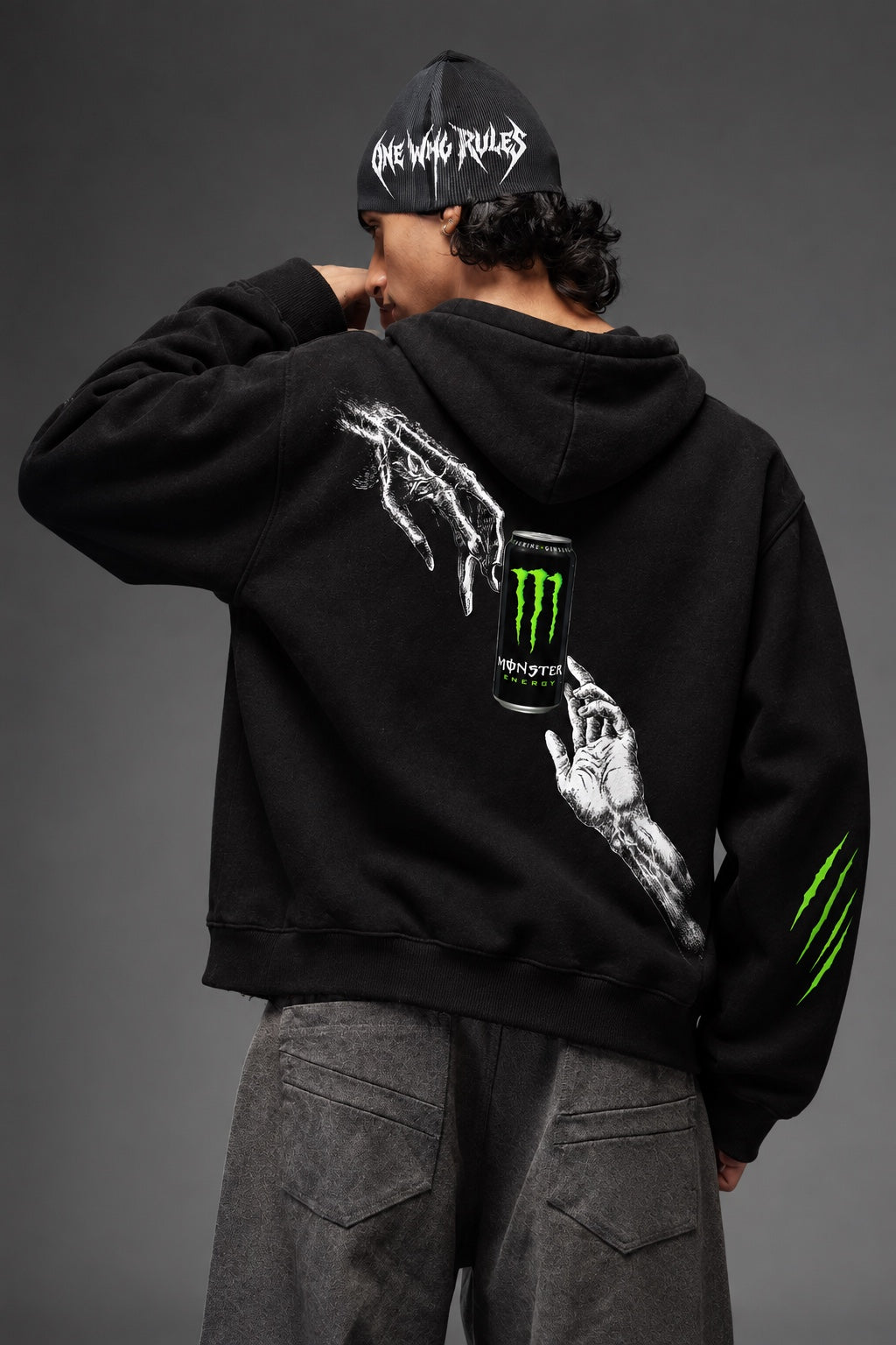 AMARCO MONSTER black hoodie back graphic close-up with raised arm