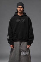 Front portrait of the black Porsche 911 oversized hoodie with outlined 911 chest graphic