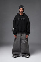 Full-length front view of the black Porsche 911 oversized hoodie