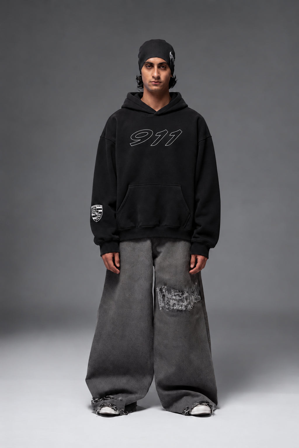 Full-length front view of the black Porsche 911 oversized hoodie