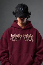 Infinite Petals oversized hoodie in Burgundy – floral chest lettering close-up